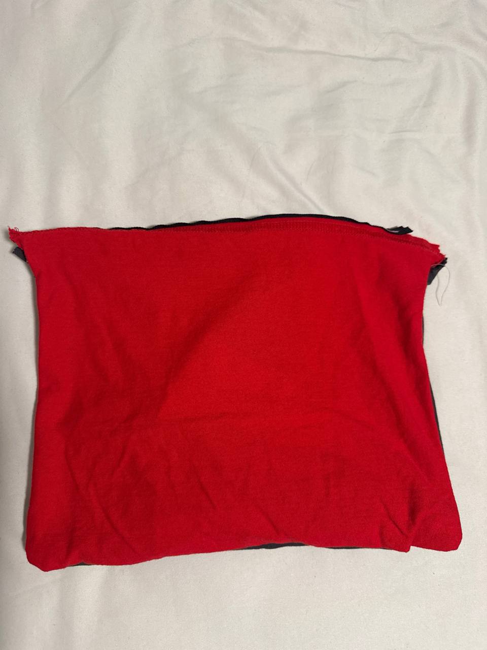 Back view of the finished t-shirt prototype 2 showing the red panel in the same landscape orientation with the existing t-shirt hem reused as the edge along the zipper